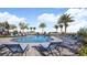 Relaxing community pool with plenty of lounge chairs at 2070 Hallier Cv, Wesley Chapel, FL 33543