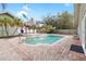 Refreshing pool with brick patio and tiki hut at 210 Lee St, Oldsmar, FL 34677