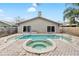 Inviting backyard oasis featuring a pool and spa at 210 Lee St, Oldsmar, FL 34677