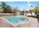 Relaxing pool area with brick patio and tiki hut at 210 Lee St, Oldsmar, FL 34677