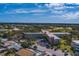 Aerial view of a condo building with a pool and surrounding landscape at 2363 Israeli Dr # 61, Clearwater, FL 33763