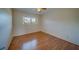 Simple bedroom with wood floor and window at 2363 Israeli Dr # 61, Clearwater, FL 33763