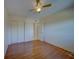 Bedroom with wood floors and ceiling fan at 2363 Israeli Dr # 61, Clearwater, FL 33763