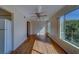 Bedroom featuring wood floors, large windows, and ceiling fan at 2363 Israeli Dr # 61, Clearwater, FL 33763