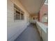 Covered walkway with light-colored walls and railing at 2363 Israeli Dr # 61, Clearwater, FL 33763