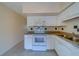 White kitchen with granite countertops and appliances at 2363 Israeli Dr # 61, Clearwater, FL 33763