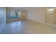 Living room with tiled floors and access to balcony at 2363 Israeli Dr # 61, Clearwater, FL 33763