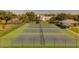 Well-maintained community tennis courts with surrounding fence at 2363 Israeli Dr # 61, Clearwater, FL 33763