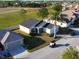 Aerial view of a single-Gathering home with a golf course nearby at 24165 Buckingham Way, Punta Gorda, FL 33980