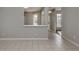 View down a hallway with gray walls and tiled floors at 24156 Buckingham Way, Punta Gorda, FL 33980