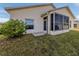 House exterior with screened lanai at 24156 Buckingham Way, Punta Gorda, FL 33980