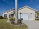 House exterior with palm tree and driveway at 24156 Buckingham Way, Punta Gorda, FL 33980