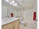 Clean bathroom, featuring wood vanity and bathtub at 2421 Lancaster Dr, Sun City Center, FL 33573