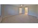 Spacious bedroom with carpeted floor and ceiling fan at 2421 Lancaster Dr, Sun City Center, FL 33573