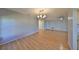 Dining area with light-grey walls and laminate flooring at 2421 Lancaster Dr, Sun City Center, FL 33573