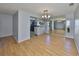 Spacious dining area with hardwood floors and a view into the kitchen at 2421 Lancaster Dr, Sun City Center, FL 33573