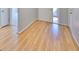 Light and bright entry hall with wood-look laminate flooring at 2421 Lancaster Dr, Sun City Center, FL 33573