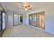 Bright sunroom with tile flooring and sliding glass doors at 2421 Lancaster Dr, Sun City Center, FL 33573