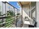 Private balcony with seating, offering a relaxing outdoor space with views of the community at 2511 N Grady Ave # 23, Tampa, FL 33607