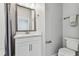 This cozy bathroom includes a modern vanity, toilet, and shower with white subway tile surround at 2511 N Grady Ave # 23, Tampa, FL 33607