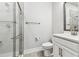 Bright bathroom featuring a glass shower and modern vanity at 2511 N Grady Ave # 23, Tampa, FL 33607