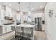 Bright, modern kitchen with stainless appliances, white cabinets, and pendant lighting at 2511 N Grady Ave # 23, Tampa, FL 33607