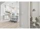 Eat-in kitchen featuring a view of half-bath, stainless steel appliances and white cabinets at 2511 N Grady Ave # 23, Tampa, FL 33607