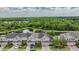 Townhome community near a pond with lush landscape at 26914 Juniper Bay Dr, Wesley Chapel, FL 33544