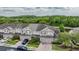 Townhomes with tree-lined backdrop and community view at 26914 Juniper Bay Dr, Wesley Chapel, FL 33544