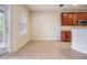 Kitchen features wood cabinets and a sliding glass door at 26914 Juniper Bay Dr, Wesley Chapel, FL 33544