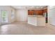 Bright kitchen boasts wood cabinets and tile floors at 26914 Juniper Bay Dr, Wesley Chapel, FL 33544