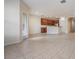 Open concept living area with tile floors and access to a patio at 26914 Juniper Bay Dr, Wesley Chapel, FL 33544