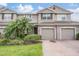 Exterior view of two-story townhouse at 26914 Juniper Bay Dr, Wesley Chapel, FL 33544