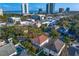 Aerial view of a neighborhood with mature trees, modern buildings and the Gulf of Mexico at 3107 W Palmira Ave, Tampa, FL 33629