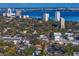 An aerial of a neighborhood near the water, with tall condos and a blue bay at 3107 W Palmira Ave, Tampa, FL 33629