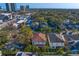 Aerial view of a neighborhood with mature trees, modern buildings and manicured landscaping at 3107 W Palmira Ave, Tampa, FL 33629