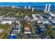 Wide aerial shot displaying a residential neighborhood, lush trees, and downtown skyline at 3107 W Palmira Ave, Tampa, FL 33629