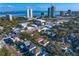 Scenic aerial view showcasing a vibrant neighborhood, modern architecture and a stunning view of the ocean at 3107 W Palmira Ave, Tampa, FL 33629