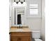 Powder room features granite counter tops, a wood vanity and a decorative mirror at 3107 W Palmira Ave, Tampa, FL 33629