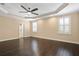 Bright bedroom with tray ceilings, hardwood floors and plantation shutters at 3107 W Palmira Ave, Tampa, FL 33629