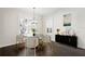 Bright and airy dining room with hardwood floors, natural light, and stylish modern furniture at 3107 W Palmira Ave, Tampa, FL 33629