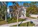 Lovely exterior of a two-story home, featuring a tile roof and well-maintained landscaping at 3107 W Palmira Ave, Tampa, FL 33629