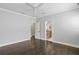 Spacious main bedroom with hardwood floors, ceiling fan and an en suite bathroom at 3107 W Palmira Ave, Tampa, FL 33629