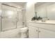 Well-lit bathroom featuring white cabinetry and a shower-tub combo at 3124 Highlands Blvd, Palm Harbor, FL 34684