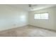 Empty bedroom with neutral carpet, a ceiling fan, and a single window for natural light at 3124 Highlands Blvd, Palm Harbor, FL 34684