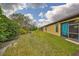 Landscaped backyard with grassy area and privacy at 314 Bluewater Falls Ct, Apollo Beach, FL 33572