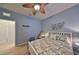 Light and airy bedroom with ceiling fan and a view of hallway at 314 Bluewater Falls Ct, Apollo Beach, FL 33572