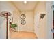 Inviting entryway with tile flooring and coat rack at 314 Bluewater Falls Ct, Apollo Beach, FL 33572