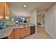 Well-equipped kitchen with granite countertops and modern cabinetry at 314 Bluewater Falls Ct, Apollo Beach, FL 33572