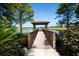 Serene lakeside gazebo with wooden walkway at 314 Bluewater Falls Ct, Apollo Beach, FL 33572